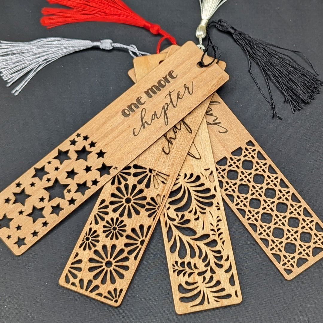 a group of wooden bookmarks with tassels from Giroux Woodcraft
