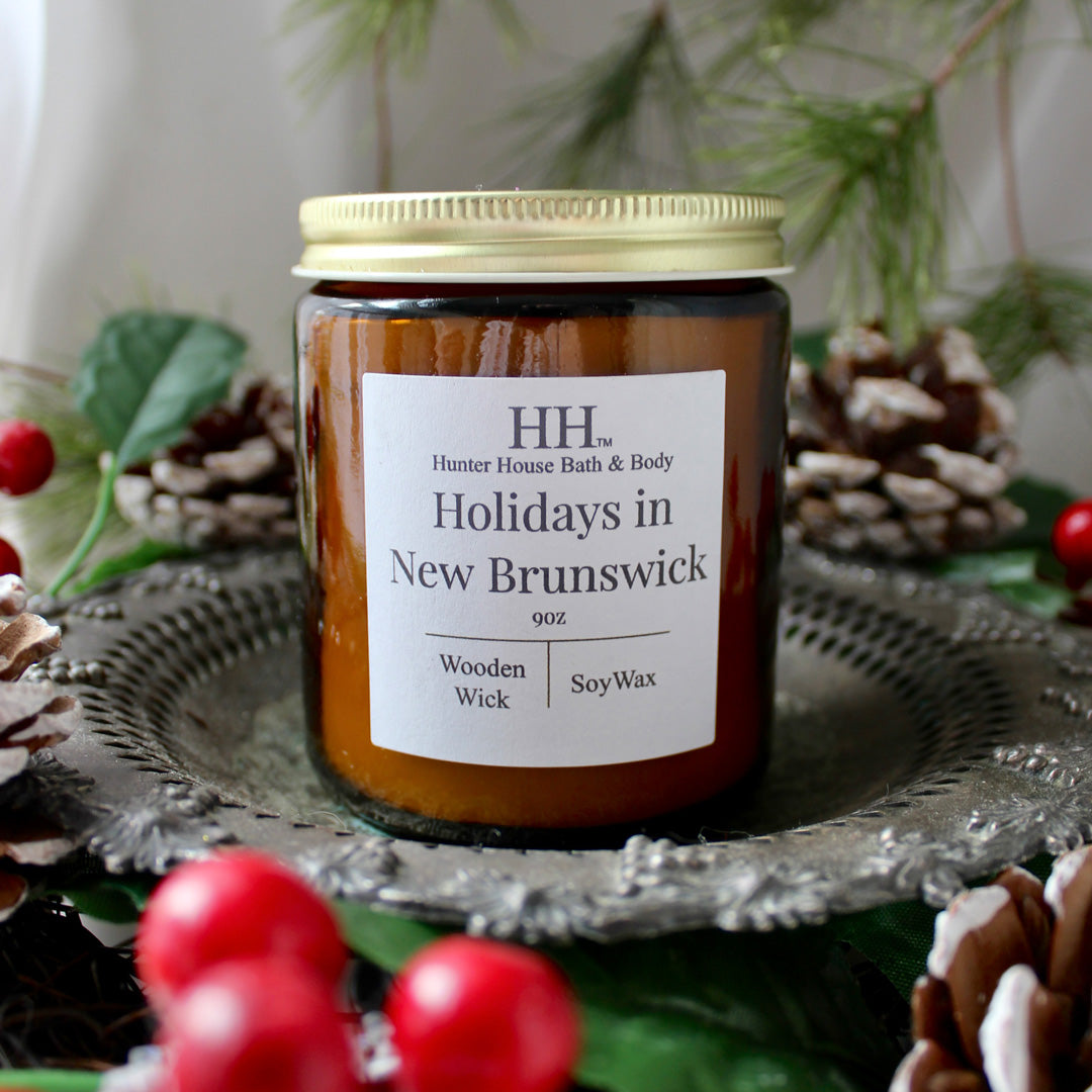 A Holidays in New Brunswick candle from Hunter House on a Holiday theme plate