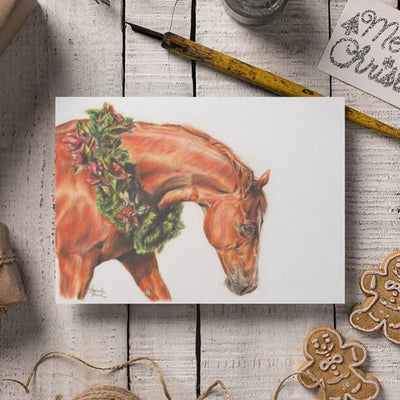 a Holidays Card with a drawing of a horse with a wreath on it