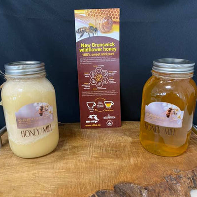 jars of honey and a sign from River Bend Bees