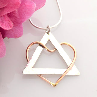 a necklace with an Adoption symbol pendant from Soul's Journey