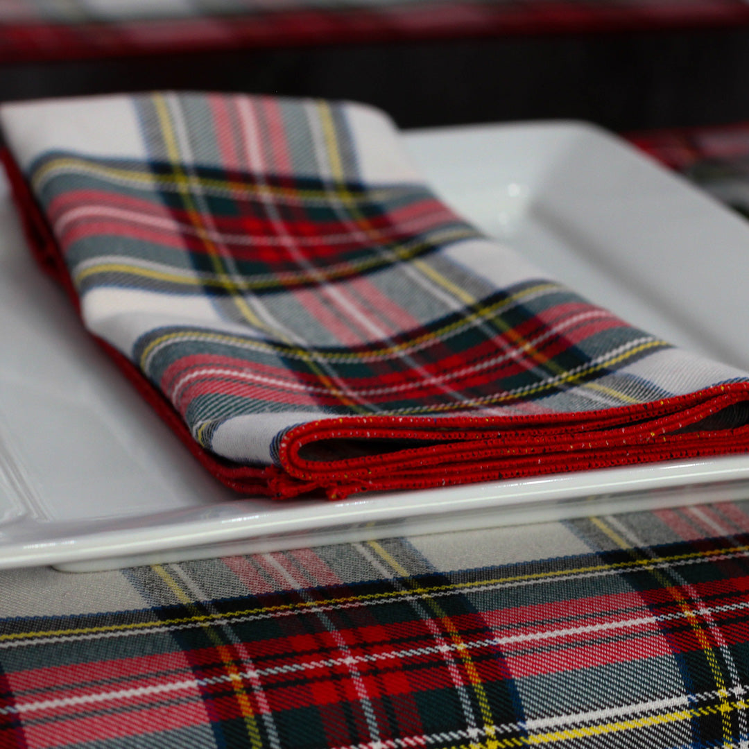 a white plate with a red and black napkin from Taylors Tartans on it